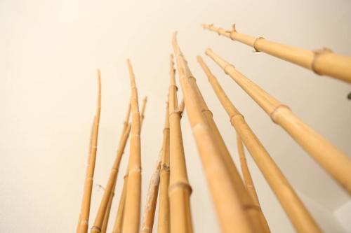 a bunch of bamboo sticks in a wall at Villas H2O in Tulum