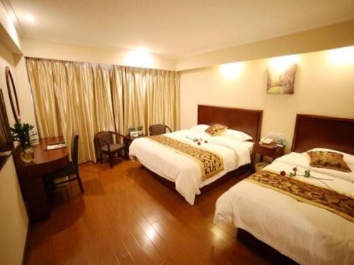 Ένα ή περισσότερα κρεβάτια σε δωμάτιο στο GreenTree Inn Suzhou Industrial Zone Yangcheng Lake Weiting Mong Kok Express Hotel