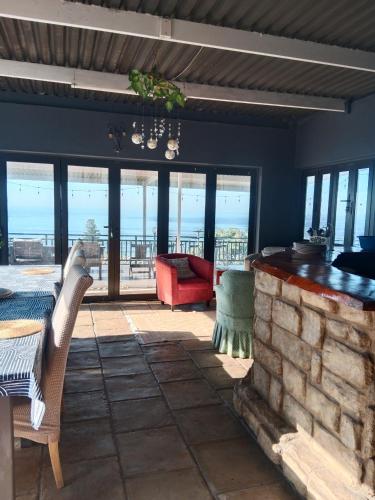 a living room with a view of the ocean at Bayview Guest House in Amanzimtoti