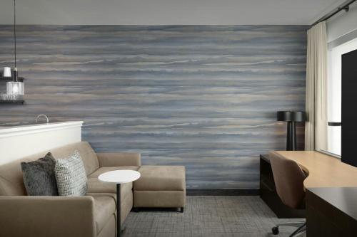 a living room with a couch and a table at Residence Inn by Marriott Dayton Miamisburg in Miamisburg
