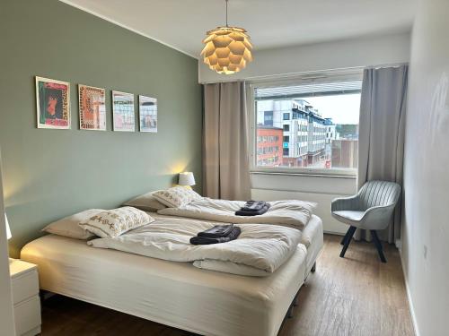 Ένα ή περισσότερα κρεβάτια σε δωμάτιο στο Aurora City View Suite