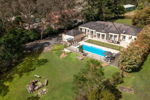 an aerial view of a house with a swimming pool at Westbrook, Kangaroo Valley in Kangaroo Valley