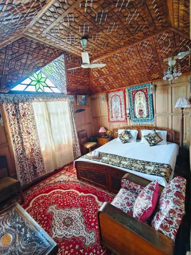 a bedroom with a bed and a couch in a room at Houseboat Sweet Star in Srinagar