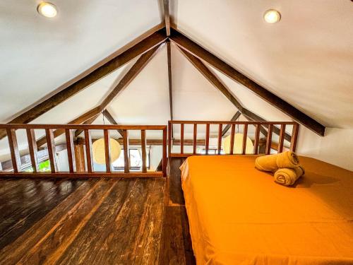 Ένα ή περισσότερα κρεβάτια σε δωμάτιο στο Cosy Villa & Apartments - Siargao