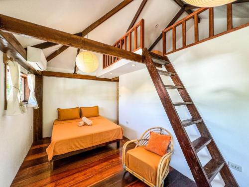 Ένα ή περισσότερα κρεβάτια σε δωμάτιο στο Cosy Villa & Apartments - Siargao