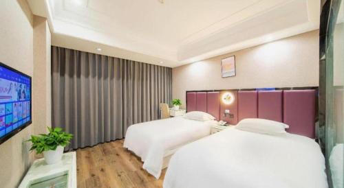 Letto o letti in una camera di mingjia hotel