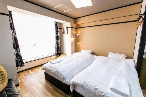 Ένα ή περισσότερα κρεβάτια σε δωμάτιο στο VIVA Apartment Yabacho