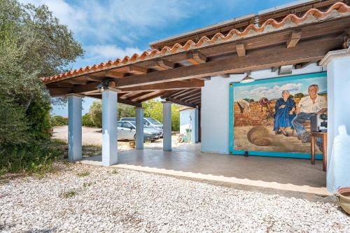 a mural on the side of a building at Su Birde Agriturismo in Orosei