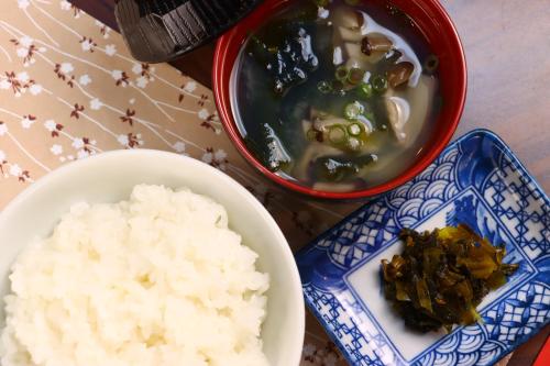a table with two bowls of food and rice at Kenrokuen in Nobeoka