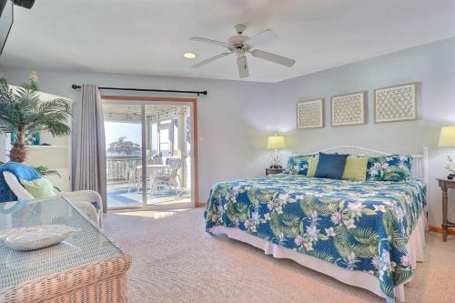 a bedroom with a bed and a glass table at 2015 - Makai in Sanderling