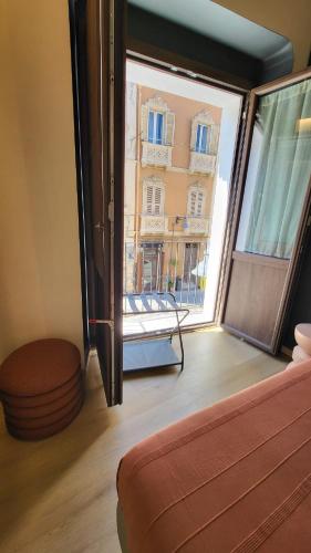 Ένα ή περισσότερα κρεβάτια σε δωμάτιο στο TWO Cagliari Charming House