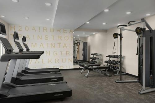 a gym with treadmills and machines in a room at Residence Inn by Marriott Dayton Miamisburg in Miamisburg