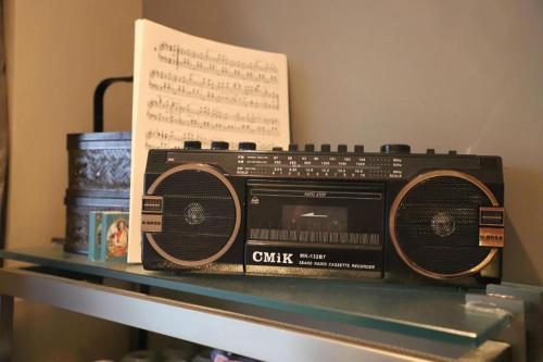 an old radio sitting on top of a shelf at Ethos Hotel Wuhan Riverside in Wuhan