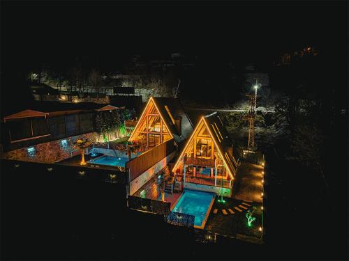 an aerial view of a house in the water at night at Grand Paradise Resort Sapanca in Sapanca