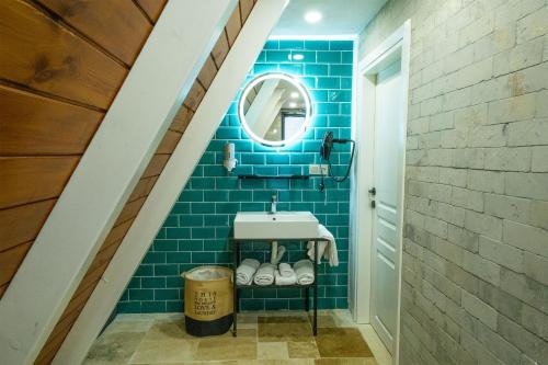 a bathroom with a sink and a mirror at Grand Paradise Resort Sapanca in Sapanca
