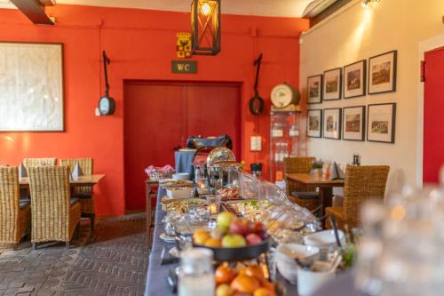 a table with fruit on it in a restaurant at Gut Basthorst in Basthorst