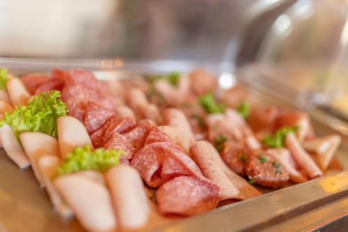 a bunch of hot dogs and sausage on a tray at Gut Basthorst in Basthorst