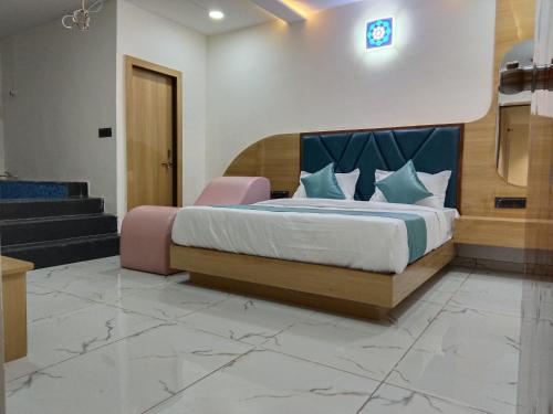 a bedroom with a bed in a room at Hotel Stay Zone in Ahmedabad