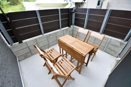 a table and chairs sitting on a patio at Sole ONNA in Inbu