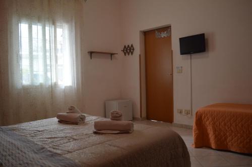 a bedroom with two dolls sitting on a bed at Il Pescatore in Marinella di Selinunte