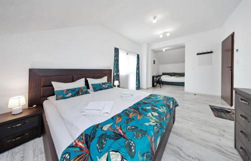 Ένα ή περισσότερα κρεβάτια σε δωμάτιο στο Vila Sol