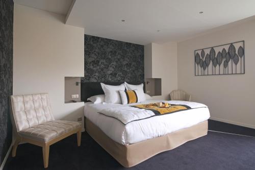 Ein Bett oder Betten in einem Zimmer der Unterkunft Le Konine - Hotel & Bar & Restaurant
