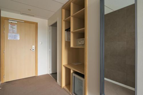 Ein Bett oder Betten in einem Zimmer der Unterkunft Le Konine - Hotel & Bar & Restaurant