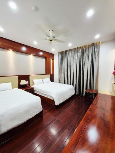 Postel nebo postele na pokoji v ubytování Pandora Hotel Cần Thơ