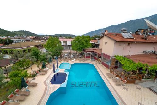 an aerial view of a hotel with a swimming pool at Suzanne Hotel & Restaurant in Fethiye