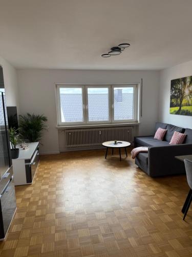 a living room with a couch and a table at Ferienwohnung Klaus in Clausen