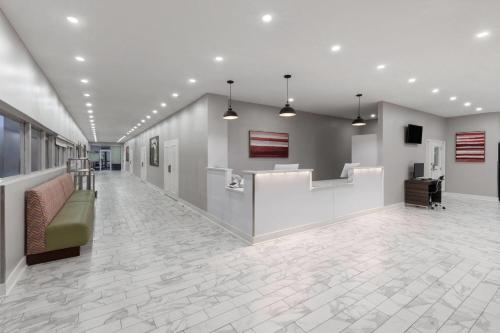 a lobby of a hospital with a waiting room at Days Inn by Wyndham Kenner/New Orleans Airport South in Kenner