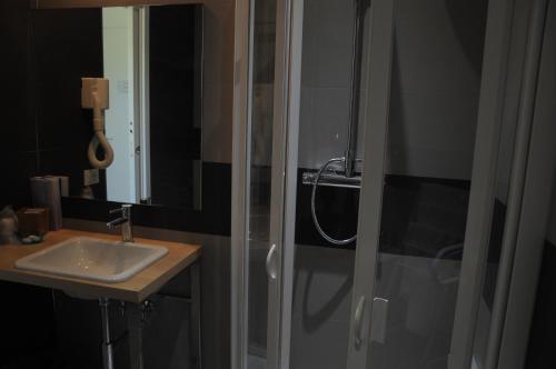 a bathroom with a shower and a sink at Hotel La Tavernetta in Campobasso