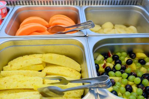 four plastic containers filled with different types of food at Hotel Las Vegas in Lido di Jesolo