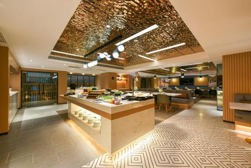 a lobby of a hotel with a breakfast buffet at Atour Hotel Beijing Tongzhou Liyuan Subway Station in Tongzhou