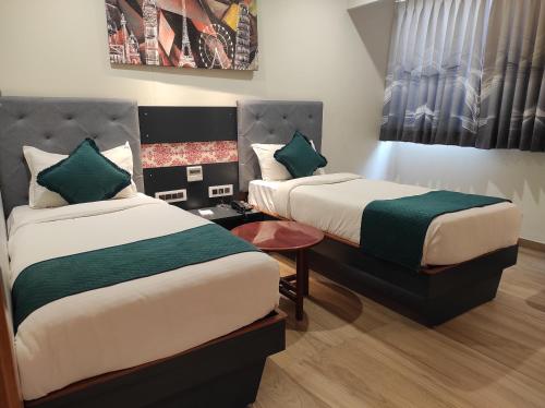 Postel nebo postele na pokoji v ubytování Empyrean Resort