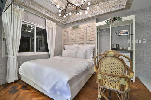 Postel nebo postele na pokoji v ubytování Daegu February Hotel Suseong