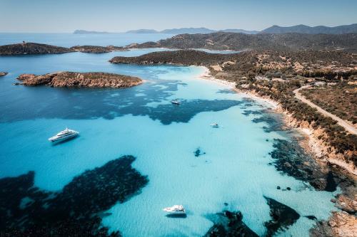 an aerial view of a beach with boats in the water at Blue House, 300m to beach in Pula