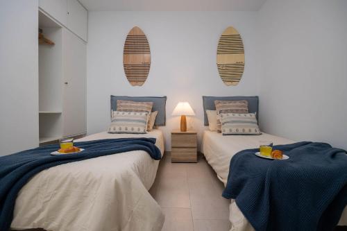 Postel nebo postele na pokoji v ubytování Aire Siroco - Beach Apartment 14