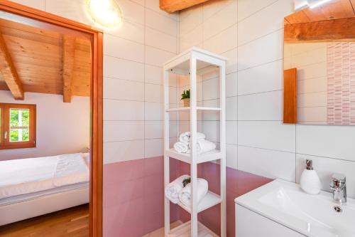 a bathroom with a sink and a mirror at Villa Dora - family house with saltwater pool in Gostinjac, Krk Island in Gostinjac