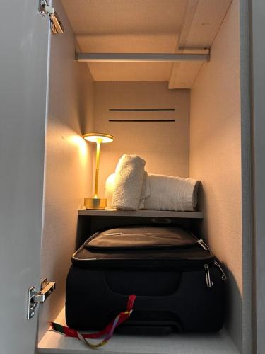 Postel nebo postele na pokoji v ubytování Literal Hotel