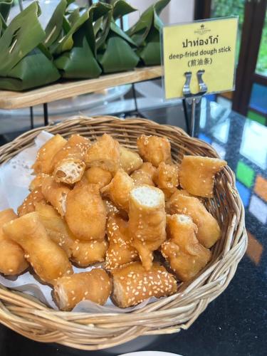 a basket of food sitting on a table at Smile Lanna Hotel in Chiang Mai