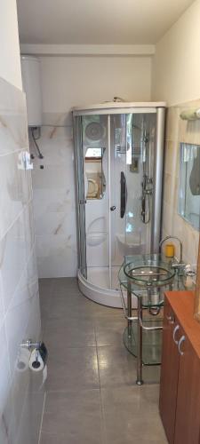 a bathroom with a glass table and a shower at New Villa Dubai - Okrug Gornji,Trogir, Hrvatska in Trogir