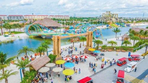 an aerial view of a water park with a roller coaster at Grand Central Hotel- Vinhomes Ocean Park 3 in Ðình Loan