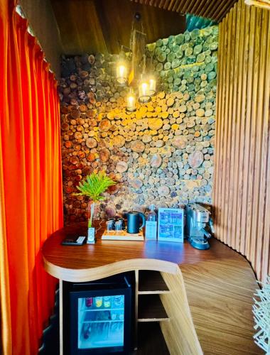 a bar in a room with a stone wall at Forest 101 in Infanta