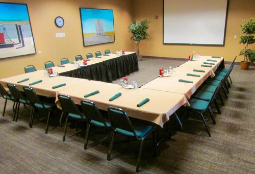 a group of tables and chairs in a room at The Portlander Inn and Marketplace in Portland