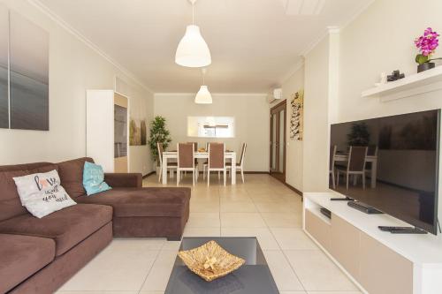 a living room with a couch and a table at B03 - Luxury 2 Bed Lagos Marina in Lagos