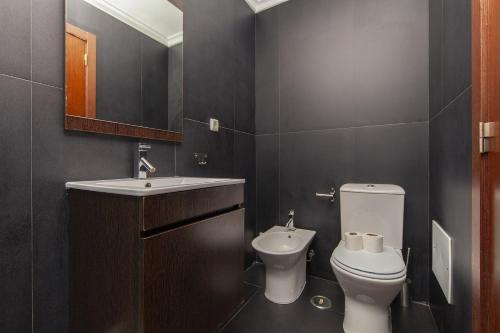 a bathroom with a white toilet and a sink at B03 - Luxury 2 Bed Lagos Marina in Lagos