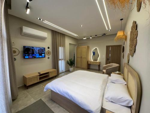 Ένα ή περισσότερα κρεβάτια σε δωμάτιο στο New Cairo Chic Studio 2