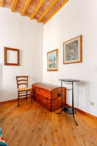 a room with a wooden table and a chair at Cosimo Charme in Chianti in Barberino di Val dʼElsa