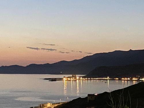 a view of a large body of water at night at Sea View - Bosa, Sardegna in Magomadas